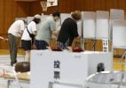 Japanese citizens voting in the polls
